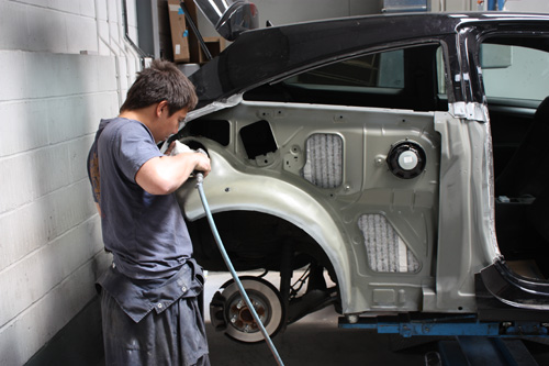 mechanic working on a car