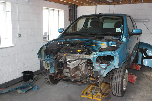 damaged car being fixed